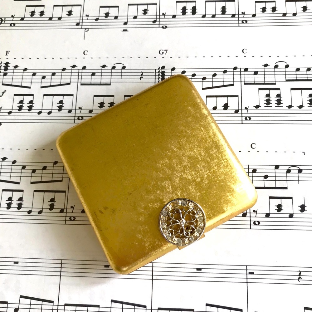 Vintage gold Avon mirror compact